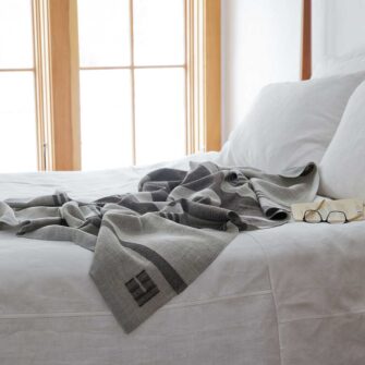 Swans Island Company's Island Throw in Grey with Brown. Handwoven in Maine with wool from Maine island sheep.