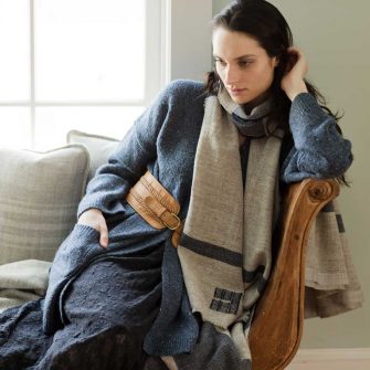 Swans Island Company's Island Scarves are handwoven in Maine with single-origin wool. Shown here in Grey with Midnight Blue.