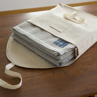 Swans Island's handwoven Heritage blankets come in this custom linen storage bag with aromatic cedar slats - for safe keeping when blanket is not in use.