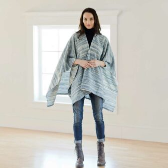 Swans Island Watercolors Cape is handwoven in Maine using our unique hand-dyed yarn - hand-dyed with all natural dyes on soft organic merino wool. Indigo/Natural colorway.