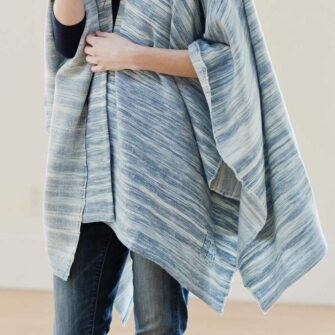 Swans Island Watercolors Cape is handwoven in Maine using our unique hand-dyed yarn - hand-dyed with all natural dyes on soft organic merino wool. Indigo/Natural colorway.
