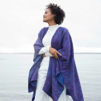 Swans Island Watercolors Cape is handwoven in Maine using our unique hand-dyed yarn. We dye our own yarns using all natural dyes on soft organic merino wool. Indigo/Beetroot colorway.