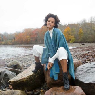 Swans Island Watercolors Swans Island Watercolors Cape is handwoven in Maine using our unique hand-dyed yarn. We dye our own yarns using all natural dyes on soft organic merino wool. Indigo/Teal colorway.