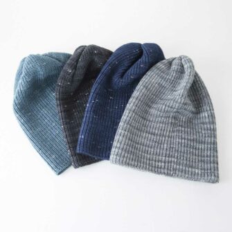 Swans Island Company's Firefly Hat is knit with hand-dyed silk/merino yarn. Made in USA. Unisex hat is shown here in Sapphire color.