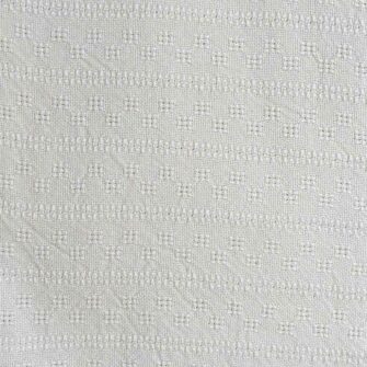 Swans Island's beautifully textured Bedford Blanket is woven in Maine in undyed natural cotton.