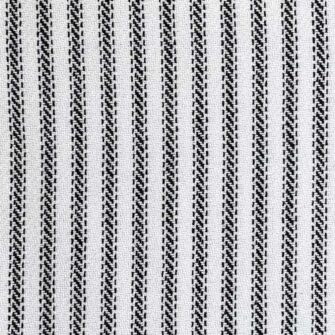 Swans Island's Cotton Ticking Throw blanket is woven in Maine with 100% American cotton.