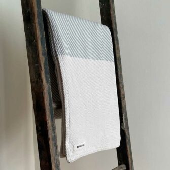 Swans Island's Everyday Cotton Throw blanket is woven in Maine with 100% American cotton.