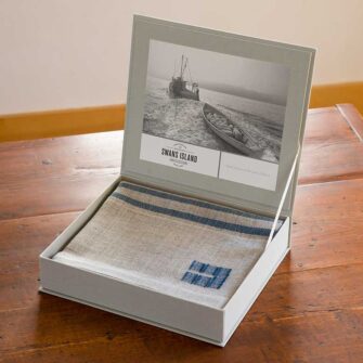 The Swans Island Heritage Throw comes in our distinctive linen presentation gift box.