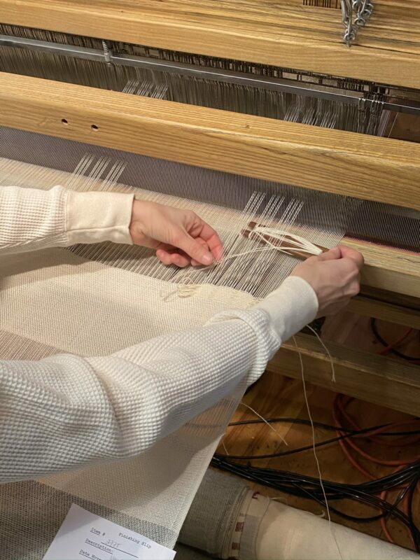 Swans Island's weaver's mark can only be woven in by hand. This is the sign of an authentic Swans Island signature handwoven product.
