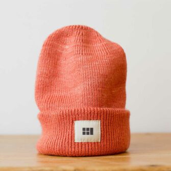 Swans Island Logo Hat - hand-dyed silk + Merino wool knit. Shown in Persimmon.