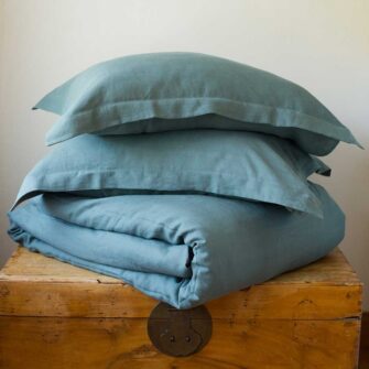 Swans Island Company's Relaxed Linen bedding is made with 100% French linen, stitched in the USA. Shown here, duvet set in Aegean.