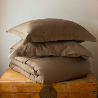 Swans Island Company's Relaxed Linen bedding is made with 100% French linen, stitched in the USA. Shown here, duvet set in Mocha.