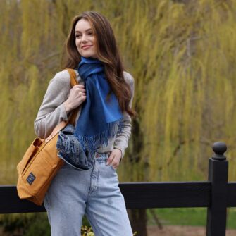 Swans Island Company's Reversible Baby Alpaca Scarf is a luxurious, soft scarf made by artisans in Peru. Shown here in Sky Blue / Marine Blue colorway.