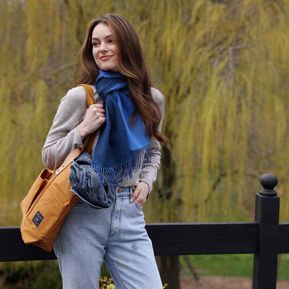 Swans Island Company's Reversible Baby Alpaca Scarf is a luxurious, soft scarf made by artisans in Peru. Shown here in Sky Blue / Marine Blue colorway.