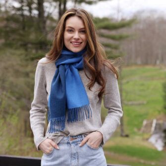 Swans Island Company's Reversible Baby Alpaca Scarf is a luxurious, soft scarf made by artisans in Peru. Shown here in Sky Blue / Marine Blue colorway.