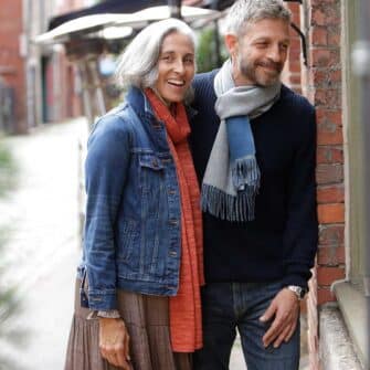 Swans Island Company's Reversible Baby Alpaca Scarf is a luxurious, soft scarf made by artisans in Peru. Unisex style for men an women. Shown here in Marine Blue /Light Grey colorway.