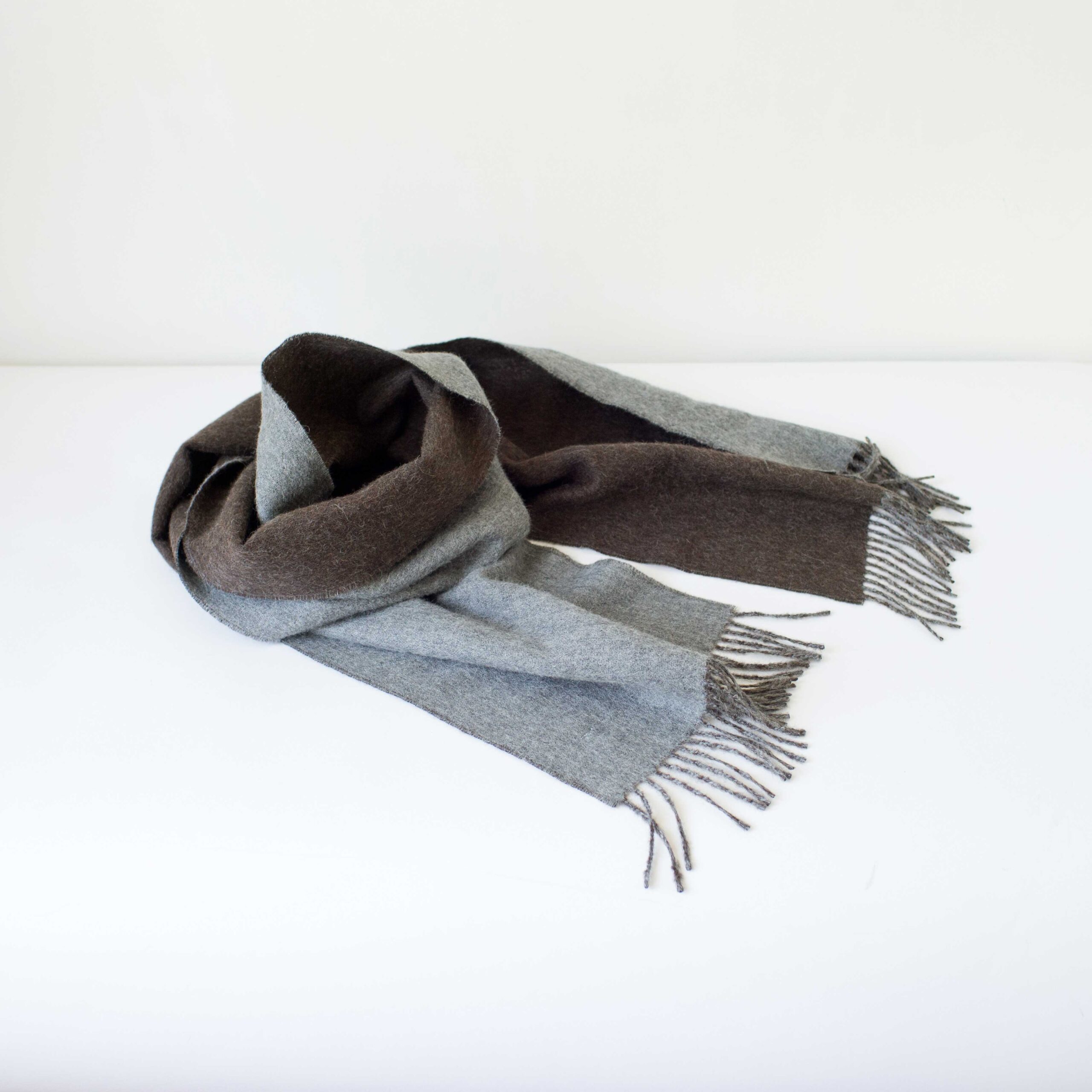 Swans Island Company's Reversible Baby Alpaca Scarf is a luxurious, soft scarf for men and women. Shown here in Taupe / Lt. Grey colorway. Swatch