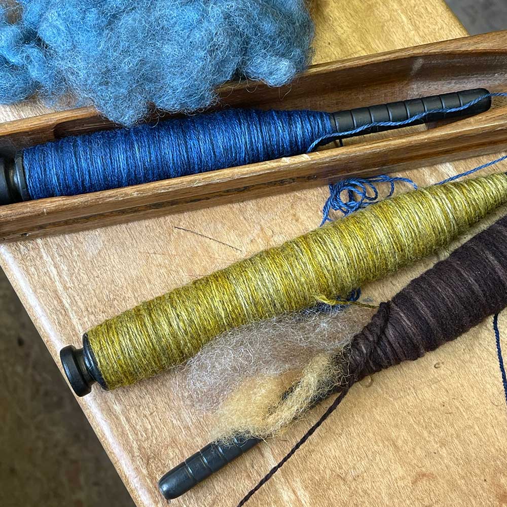 Swans Island Co. Ocean Limited Edition Throws - Colorful hand-dyed yarns and wool roving, ready to be woven into a throw.