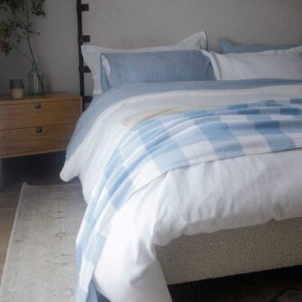 Swans Island Company's Cotton Gingham XL Check Blanket - woven in Maine on antique looms. Made with 100% soft American cotton. Shown here in Blue and White.