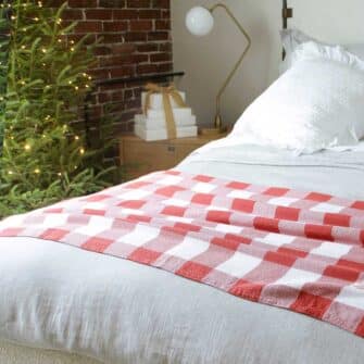 Swans Island Company's Cotton Gingham XL Check Blanket - woven in Maine on antique looms. Made with 100% soft American cotton. Shown here in Red and White.