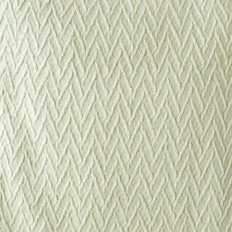 Swans Island Company's Charisma Blanket. Soft 100% Cotton blanket with woven herringbone texture. Made in USA with 100% American cotton. Shown here in Celadon. Swatch