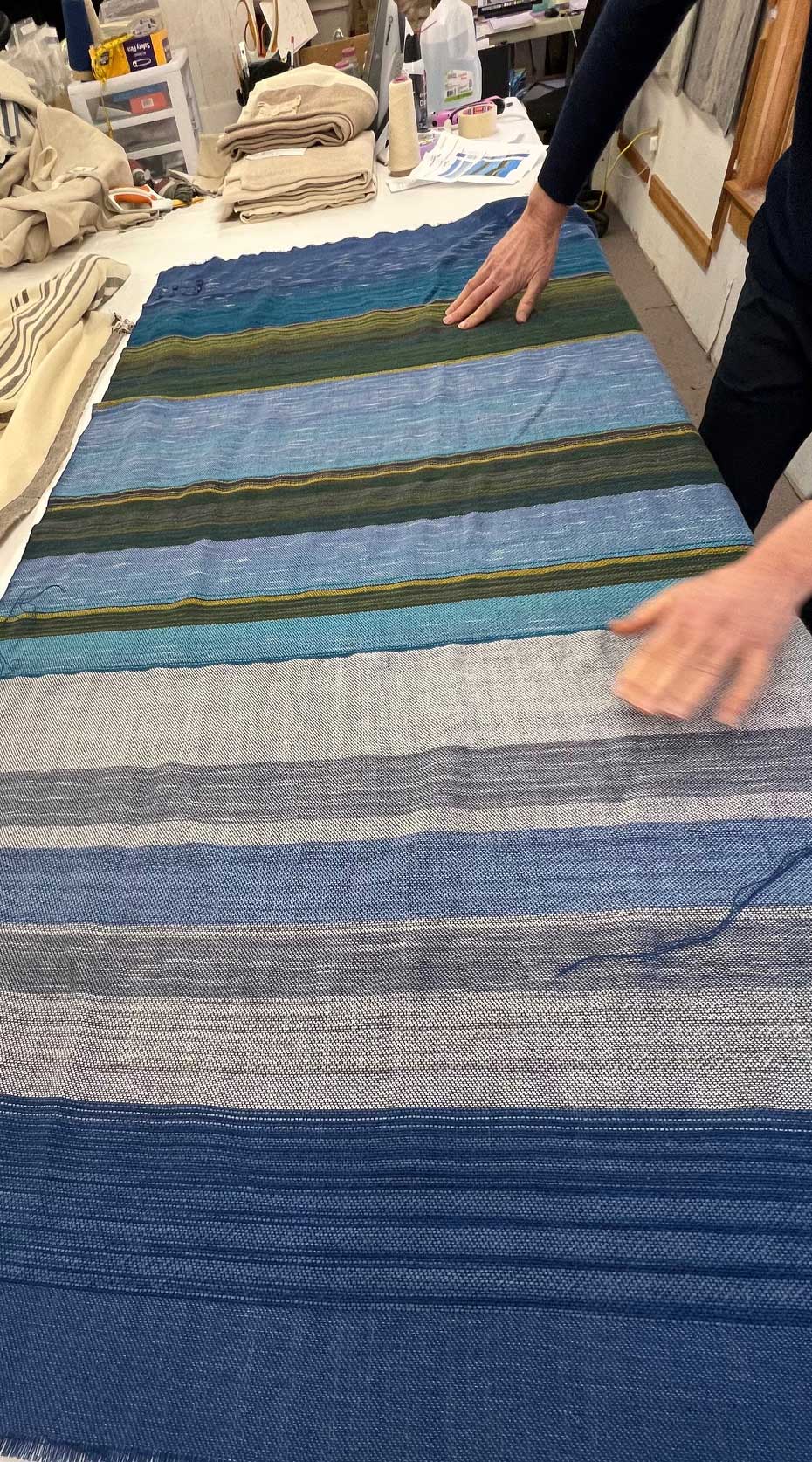 The Swans Island & Eric Hopkins Ltd. Edition Throw 2024. Detail closeup showing sky and clouds interpreted in woven wool. Prototype Version #2.