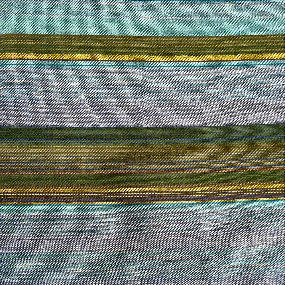 The Swans Island & Eric Hopkins Ltd. Edition Throw 2024. Detail closeup showing sky and clouds interpreted in woven wool.