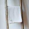 Swans Island Company's Charisma Throw. Soft 100% Cotton blanket with woven herringbone texture. Made in USA with 100% American cotton. Shown here in White.