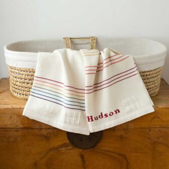 Swans Island Company's Rainbow Baby Blankets. Handwoven in Maine with soft 100% organic merino wool. Each blanket comes in a signature linen box, perfect for gifting. Custom monogramming is available.