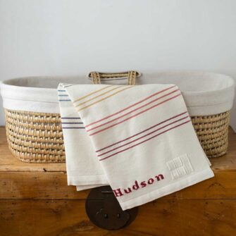 Swans Island Company's Rainbow Stripes Baby Blanket. Handwoven in Maine with soft 100% organic merino wool. Comes in a signature linen box, perfect for gifting.