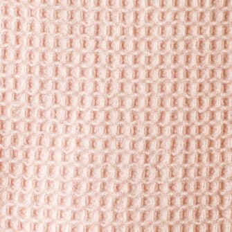 Swans Island Company's Cotton Waffle Baby Blanket is squishy and soft - perfect for tender babes. Made in Maine with 100% American cotton. Shown here in Blush. Swatch