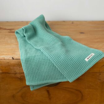 Swans Island Company's Cotton Waffle Toddler Blanket is squishy and soft - perfect for tender babes. Made in Maine with 100% American cotton. Shown here in Balsam.