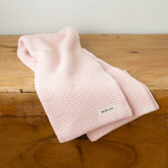 Swans Island Company's Cotton Waffle Toddler Blanket is squishy and soft - perfect for tender babes. Made in Maine with 100% American cotton. Shown here in Blush.