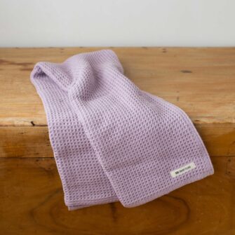 Swans Island Company's Cotton Waffle Toddler Blanket is squishy and soft - perfect for tender babes. Made in Maine with 100% American cotton. Shown here in Lavender.