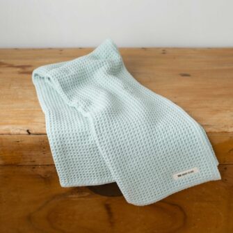 Swans Island Company's Cotton Waffle Toddler Blanket is squishy and soft - perfect for tender babes. Made in Maine with 100% American cotton. Shown here in Seaglass.