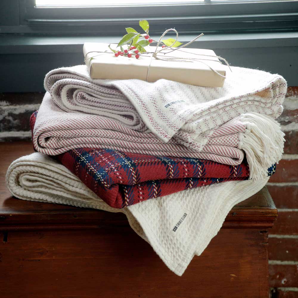 stack of throws with holiday theme