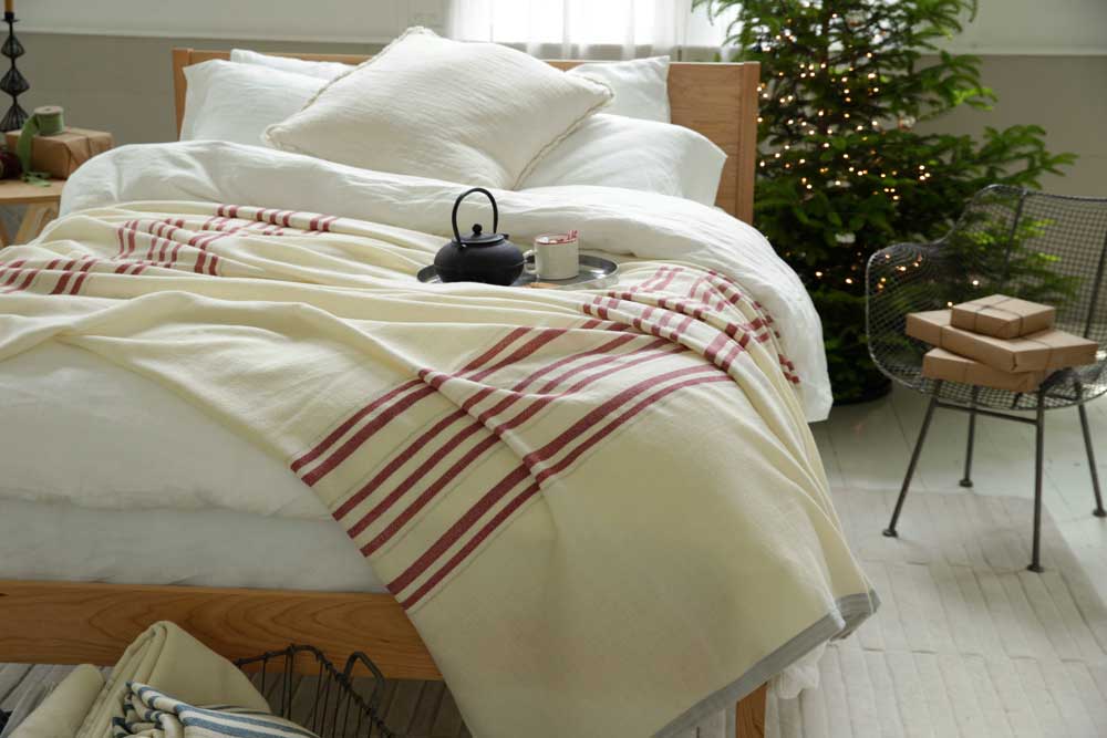 summer blanket on bed with tea, holiday decorations
