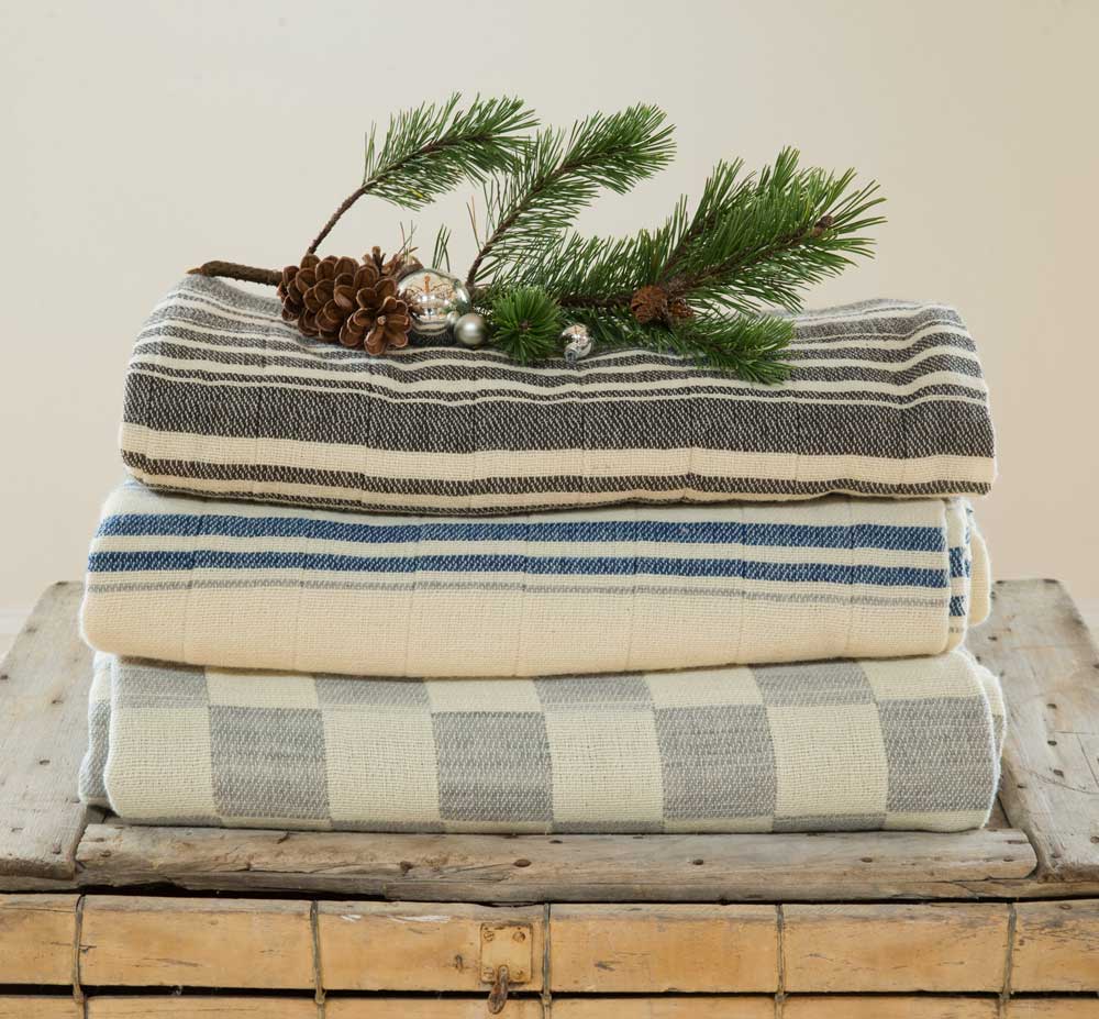throws stacked with holiday theme