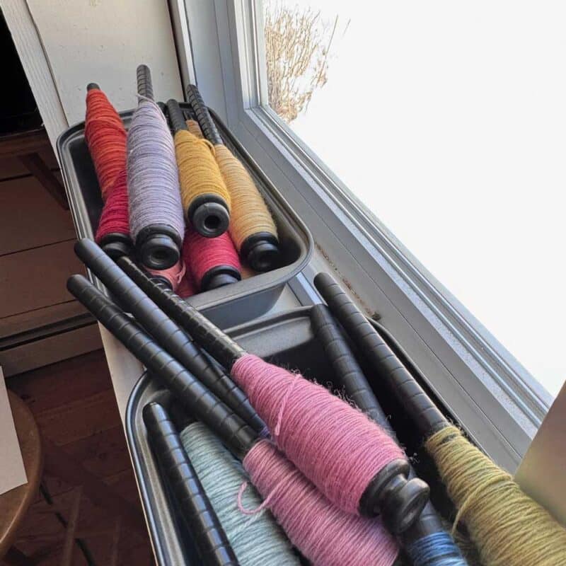 yarn bobbins in trays