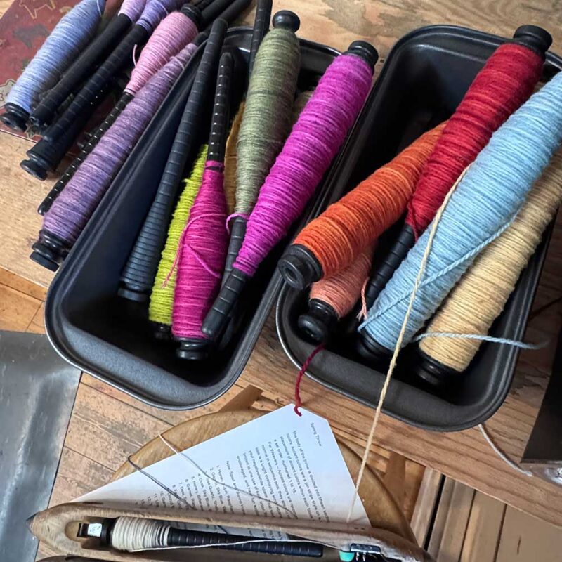 bobbins of yarn in trays