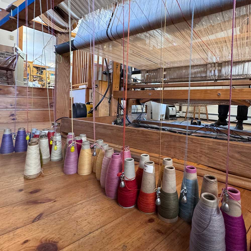 yarn bobbins on floor