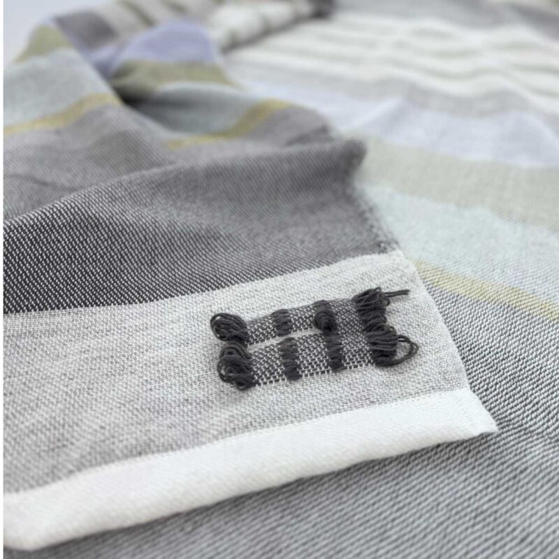 weaver's mark on handwoven throw