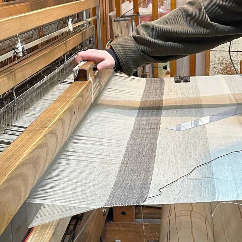 weaver's hand on loom