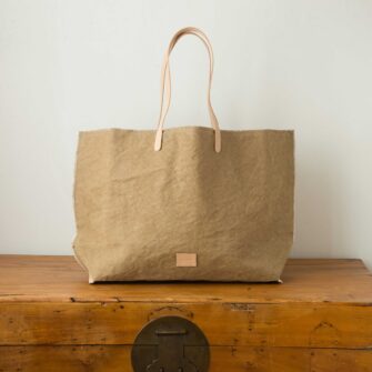 Swans Island Company's Hana Beach Tote by Graf Lantz. Cotton Canvas with leather strap. Shown here in Sand.