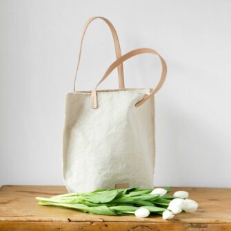 Swans Island Company's Hana Tote by Graf Lantz. Cotton Canvas with leather strap. Shown here in Natural