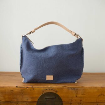 Swans Island Company's Hana Hobo Bag by Graf Lantz. Cotton Canvas with leather strap. Shown here in Horizon