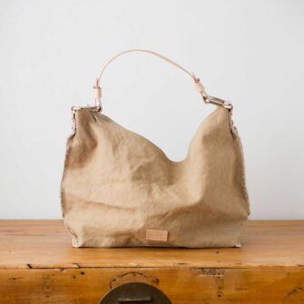 Swans Island Company's Hobo Bag by Graf Lantz - A chic shape cotton canvas bag with a deconstructed edge and leather strap. Shown here in Sand.
