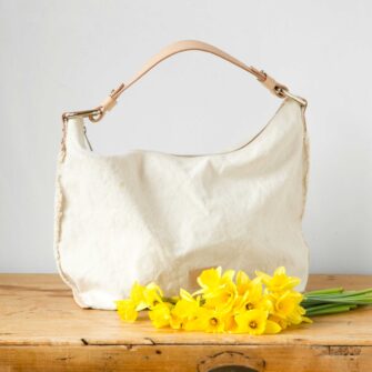 Swans Island Company's Hana Hobo Bag by Graf Lantz. Cotton Canvas with leather strap. Shown here in Natural