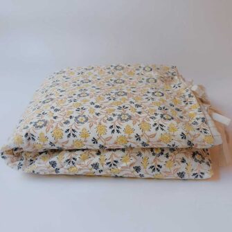 Swans Island Abha Duvet Cover by Soil to Studio. Block printed by hand in India with bright playful patterns. Shown here in natural with gold and blue floral.