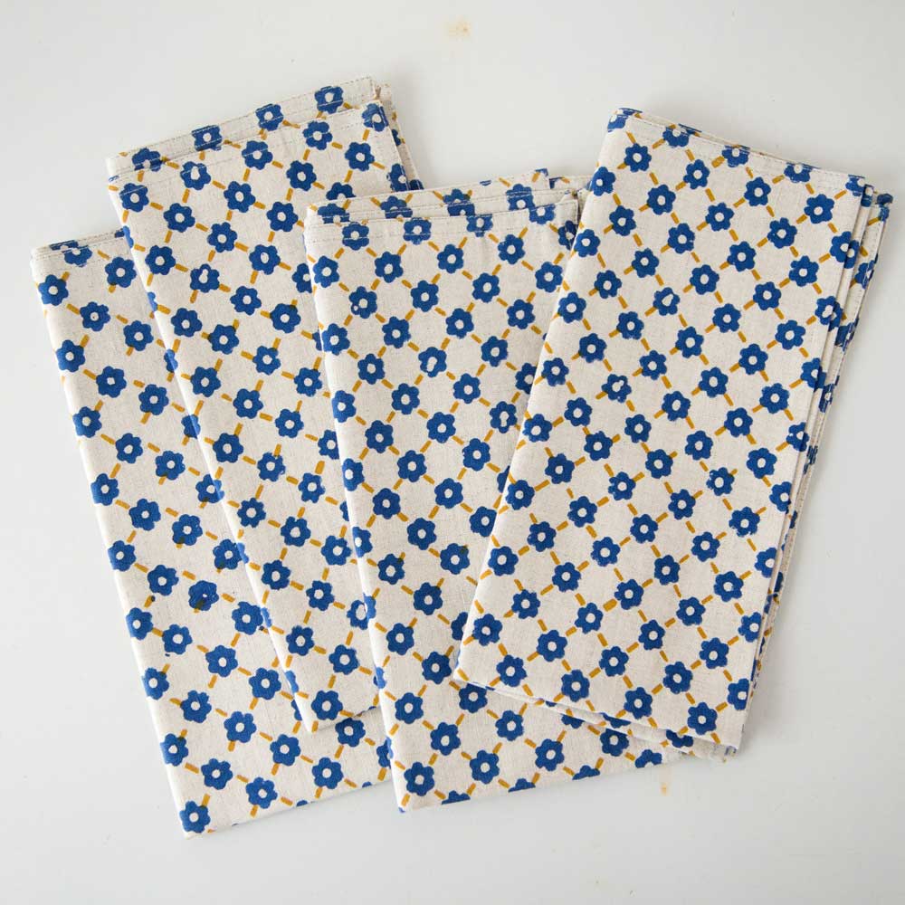 Swans Island Company's Pia Napkins by Soil to Studio. Block printed by hand in India with bright playful patterns. Shown here in Natural with yellow and blue. Set of four.